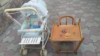 Детскую коляску в комплекте с детским стульчиком