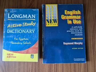 Книги Longman Dictionary и English Grammar in Use.