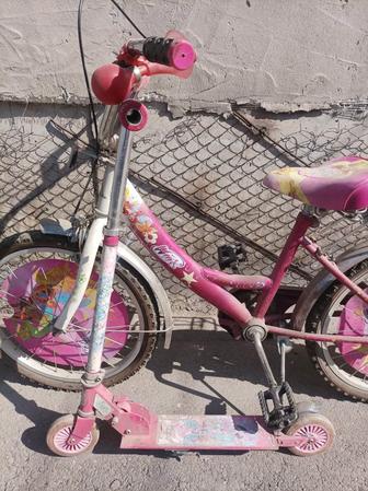 Детский велосипед и самокат.